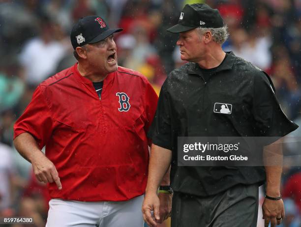 Boston Red Sox manager John Farrell, after being thrown out of the game by the home plate umpire Mark Wegner continued to argue with first base...