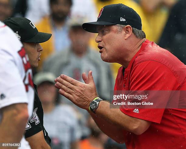 Boston Red Sox manager John Farrell, continues argueing with home plate umpire Mark Wegner after he was thrown out of the game in the second inning....