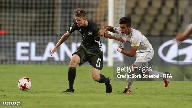 Jan Boller of Germany is challenged by Younes Delfi of Iran during the FIFA U-17 World Cup India 2017 group C match between Iran and Germany at...