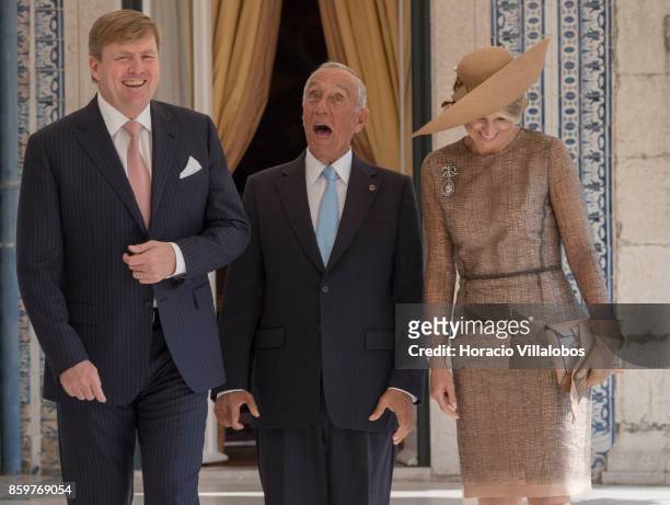 King Willem-Alexander of The Netherlands and Queen Maxima of The Netherlands share a laugh with Portuguese President Marcelo Rebelo de Sousa in a...