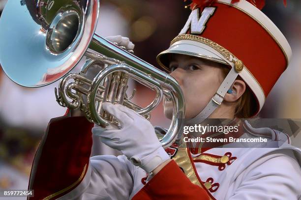 Bandmember of the Nebraska Cornhuskers performs before the game against the Wisconsin Badgers at Memorial Stadium on October 7, 2017 in Lincoln,...