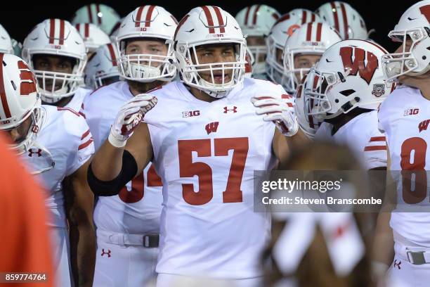 Defensive end Alec James of the Wisconsin Badgers gets ready to lead the team on the field before the game against the Nebraska Cornhuskers at...