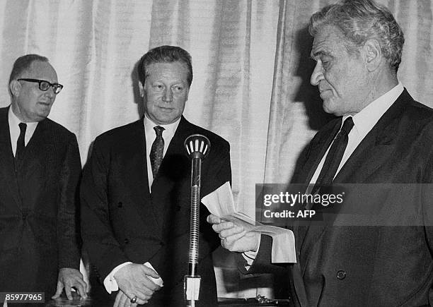 Picture taken on December 08, 1966 in Paris, shows new-elected member of the Academie Francaise , writer and politician Maurice Druon looking at his...