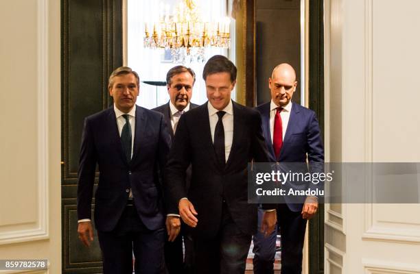 Dutch political leaders Sybrand Buma , Alexander Pechtold , Mark Rutte and Gert-Jan Segers arrive to make a statement about the government agreement...