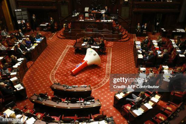 Large megaphone with a sticker of the ABVV Metaal union is seen during a plenary session of the senate at the federal parliament in Brussels, on...