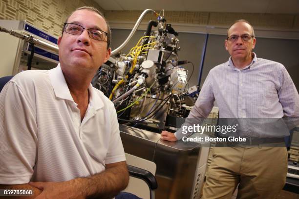 Don Burl III, left, and Dr. John A. Notte pose for a portrait with an Orion NanFab, a helium ion microscope, at Carl Ziess Micoscopy in Peabody, MA...
