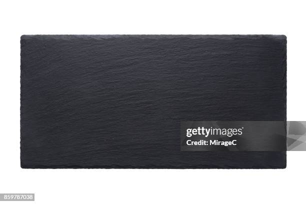 black stone tray plate on white - grey slate stock-fotos und bilder