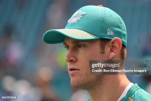 Quarterback Ryan Tannehill of the Miami Dolphins looks on before a NFL game against the Tennessee Titans on October 8, 2017 at Hard Rock Stadium in...