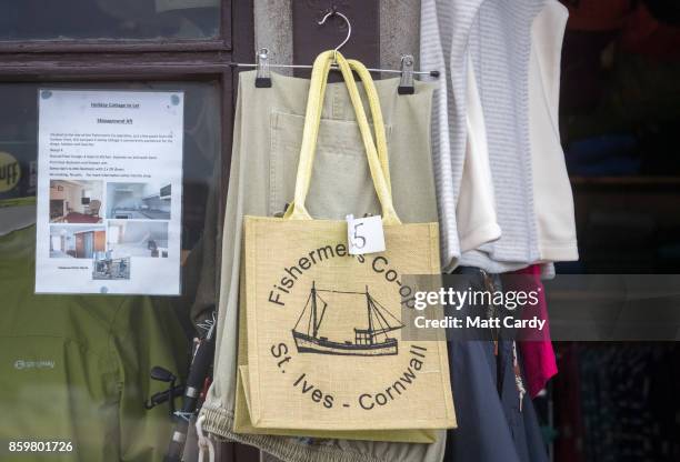 Poster for a holiday let property in the town of St Ives, which has introduced measures to limit the number of second homes, is seen in the window of...