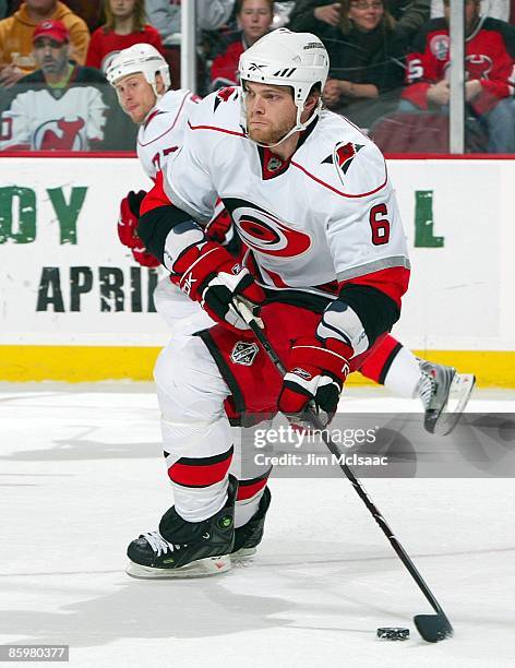 Tim Gleason of the Carolina Hurricanes skates against the New Jersey Devils at the Prudential Center on April 11, 2009 in Newark, New Jersey. The...