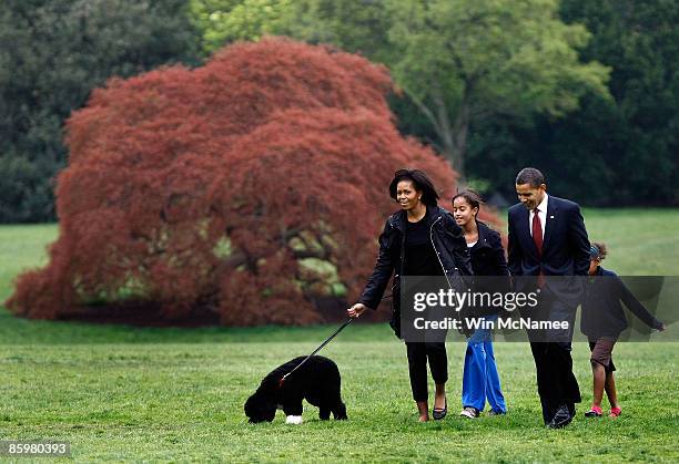 President Barack Obama , First Lady Michelle and their daughters, Sasha and Malia , introduce their new dog, a Portuguese water dog named Bo, to the...