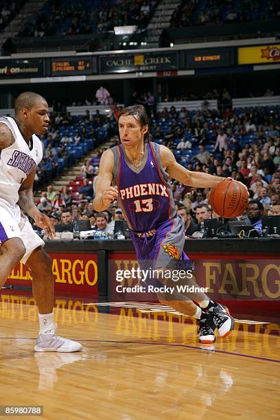 Steve Nash of the Phoenix Suns makes a move to the basket against Rashad McCants of the Sacramento Kings during the game at Arco Arena on March 29,...