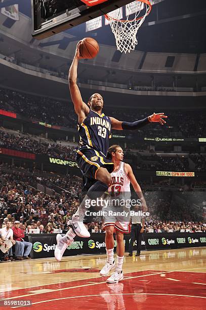 Danny Granger of the Indiana Pacers takes the ball to the basket against the Chicago Bulls during the game on March 28, 2009 at the United Center in...