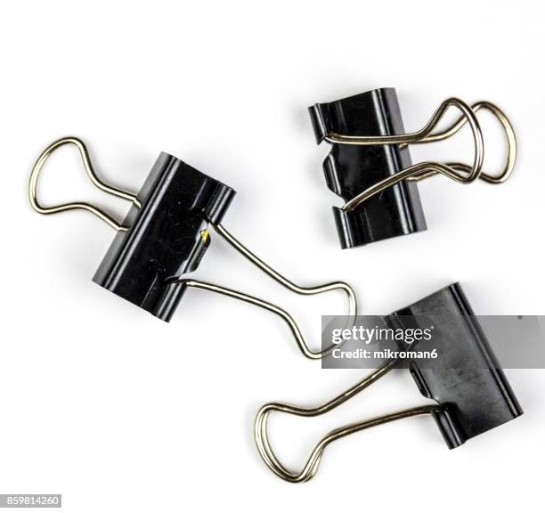 black binder clips on white background - clip stock-fotos und bilder