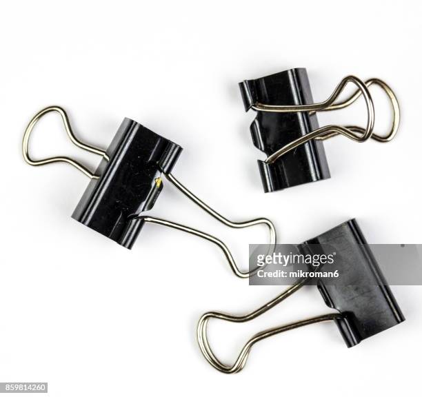 black binder clips on white background - clip stock pictures, royalty-free photos & images