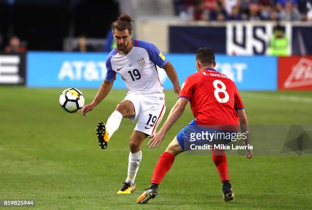 Graham Zusi of the United States controls the ball against Bryan Oviedo of Costa Rica during the FIFA 2018 World Cup Qualifier at Red Bull Arena on...