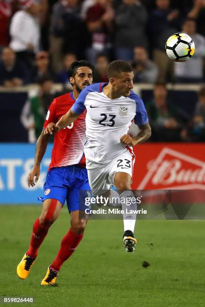 Fabian Johnson of the United States heads the ball against Bryan Ruiz of Costa Rica during the FIFA 2018 World Cup Qualifier at Red Bull Arena on...