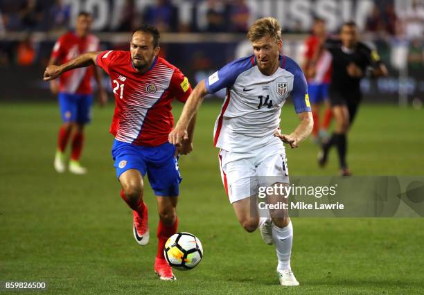 Marco Urena of Costa Rica competes for the ball with Tim Ream of the United States during the FIFA 2018 World Cup Qualifier at Red Bull Arena on...