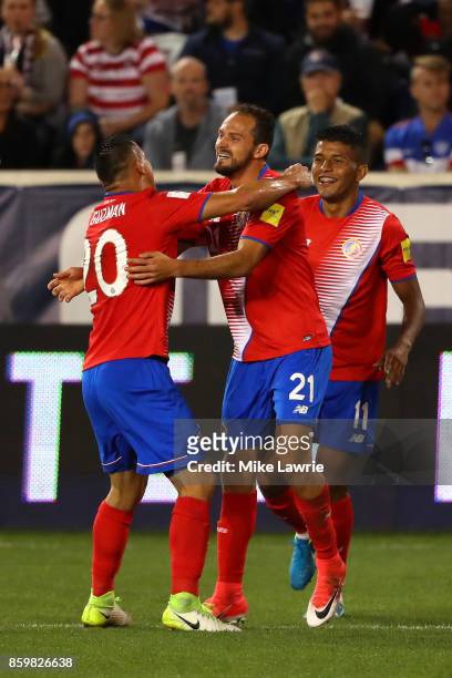 Marco Urena of Costa Rica celebrates scoring his team's second goal against the United States with teammate Johnny Acosta during the FIFA 2018 World...