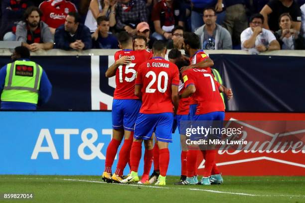 Marco Urena of Costa Rica celebrates scoring his team's first goal against the United States during the FIFA 2018 World Cup Qualifier at Red Bull...