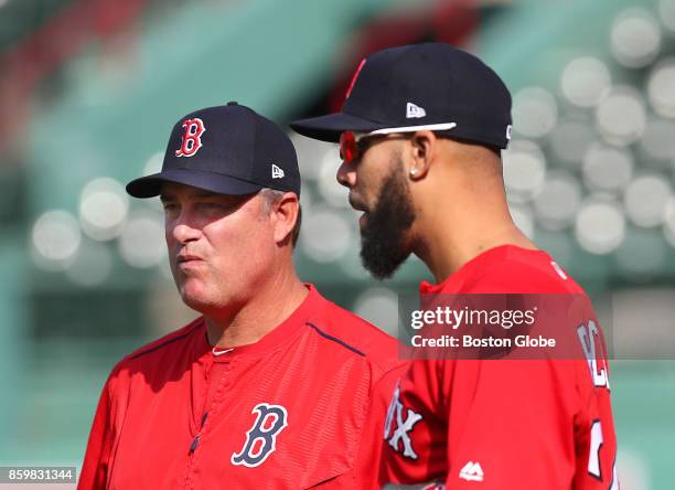 Boston Red Sox Manager John Farrell, left, and pitcher David Price stand in the outfield during a practice in preparation for Game 3 of the ALCS...