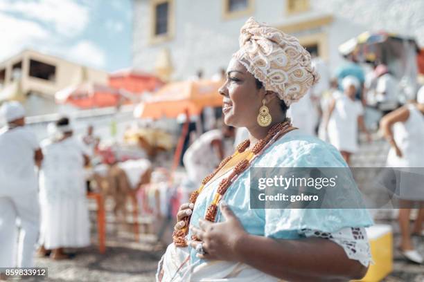 baiana in traditional costume in front of church in salvador - salvador bahia stock pictures, royalty-free photos & images