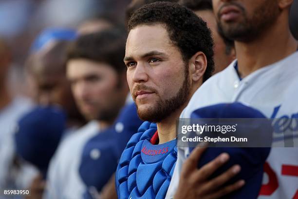 Catcher Russell Martin of the Los Angeles Dodgers stands with teammates during the singing of "God Bless America" during the seventh inning stretch...