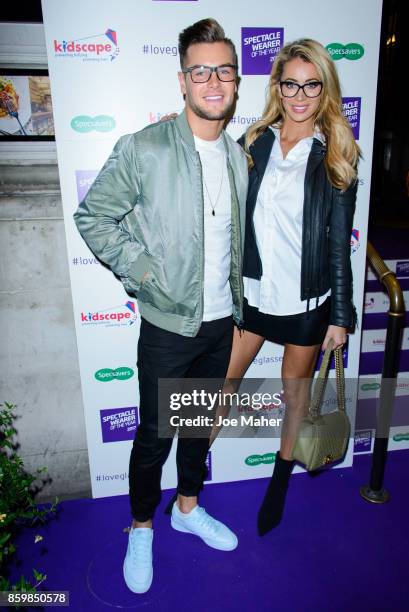 Chris Hughes and Olivia Attwood during a photocall for Specsaver's Spectacle Wearer Of The Year at 8 Northumberland Avenue on October 10, 2017 in...