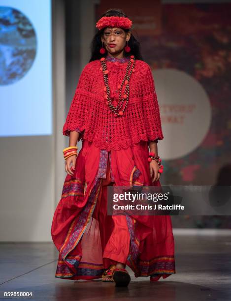 Victims of acid attacks showcase fashion on the catwalk during the ActionAid Fashion Show held at The Old Truman Brewery on October 10, 2017 in...