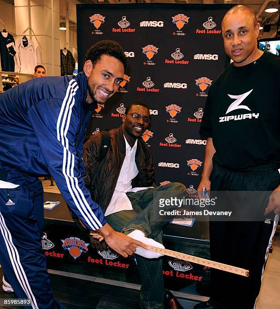 Jared Jeffries, a fan and John Starks attend the Foot Locker and New York Knicks search for the biggest foot in New York at the Foot Locker flagship...