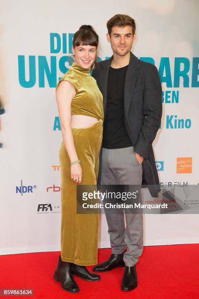 Victoria Schulz and Lucas Reiber attend the premiere of 'Die Unsichtbaren' at Kino International on October 10, 2017 in Berlin, Germany.