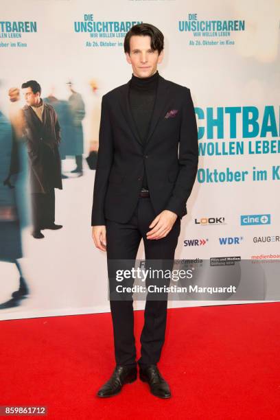 Sabin Tambrea attends the premiere of 'Die Unsichtbaren' at Kino International on October 10, 2017 in Berlin, Germany.