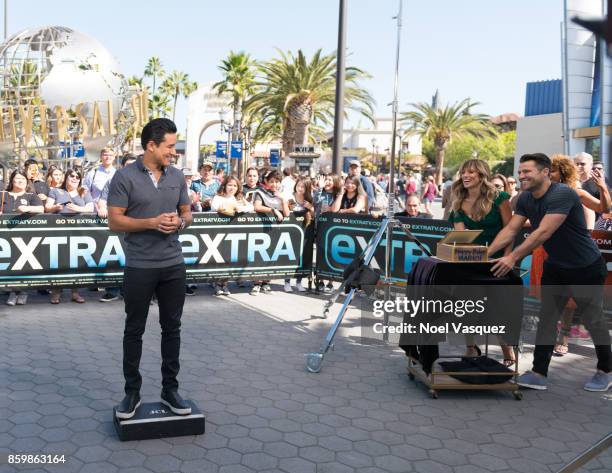 Renee Bargh and Mark Wright sing Happy Birthday to Mario Lopez at "Extra" at Universal Studios Hollywood on October 10, 2017 in Universal City,...