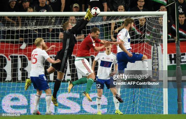 Hungary's Marton Eppel vies with Faroe Islands' Odmar Faero , goalkeeper Gunnar Nielsen , Ari Jonsson and Rogvi Baldvinsson during the FIFA World Cup...