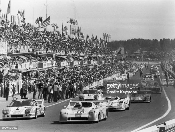 Cars at the start of the 24 Hours of Le Mans, at the Circuit de la Sarthe, France, 14th June 1975. In the foreground are a Ligier JS2 and a Mirage...