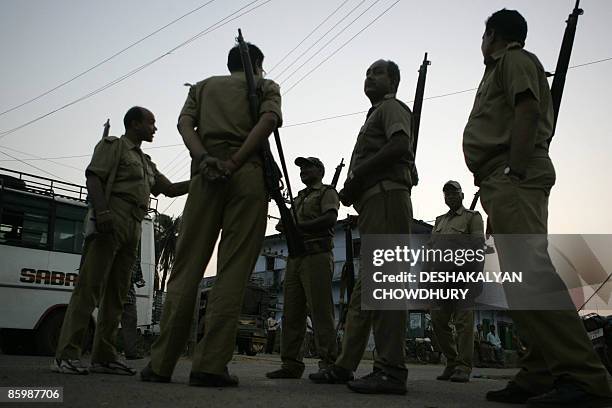 Indian police officials stand guard outside an election control room in Satgawan some 200kms north of Ranchi on April 15 on the eve of the first...