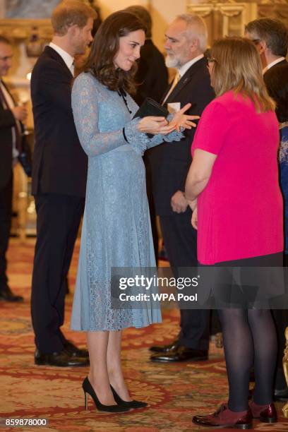 Catherine, Duchess of Cambridge attends a reception on World Mental Health Day to celebrate the contribution of those working in the mental health...