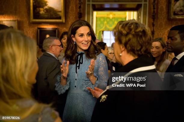 Catherine, Duchess of Cambridge attends a reception on World Mental Health Day to celebrate the contribution of those working in the mental health...