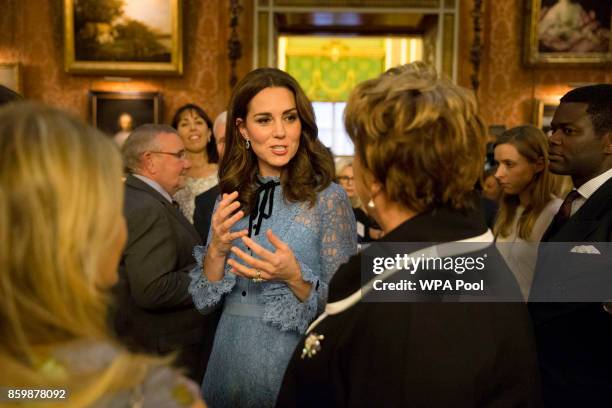 Prince William, Duke of Cambridge and Catherine, Duchess of Cambridge attend a reception on World Mental Health Day to celebrate the contribution of...