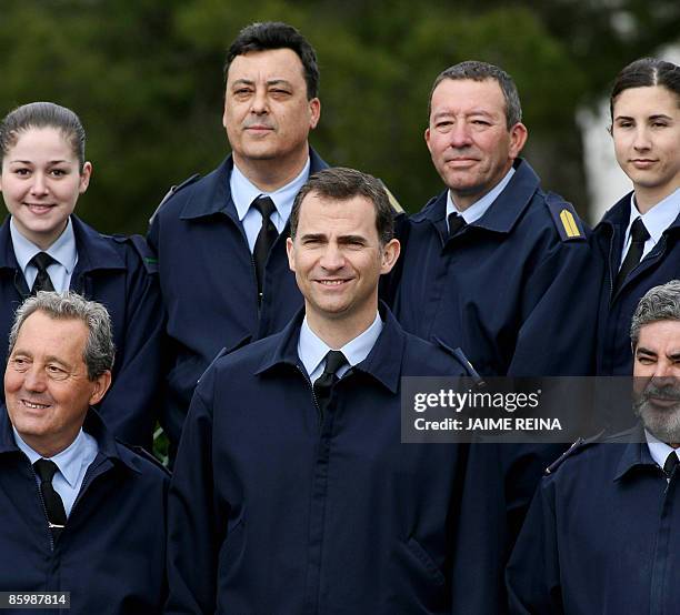 Spain's Prince Felipe poses along with millitary personnel after arriving by helicopter at the Military Base of Pollensa on Mallorca Island on April...