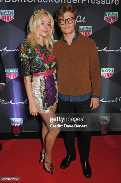 Pixie Lott and Oliver Cheshire attend the launch of the TAG Heuer Muhammad Ali Limited Edition Timepieces at BXR Gym on October 10, 2017 in London,...