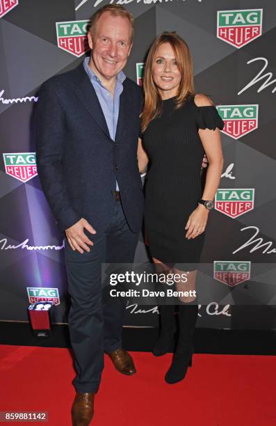 Heuer UK Managing Director Rob Diver and Geri Horner attend the launch of the TAG Heuer Muhammad Ali Limited Edition Timepieces at BXR Gym on October...