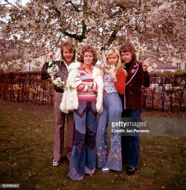 Benny Andersson, Anni-Frid Lyngstad, Agnetha Faltskog and Bjorn Ulvaeus of Swedish pop group ABBA pose for a group portrait in a garden in...