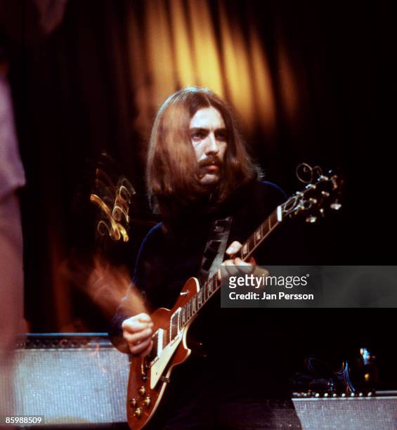 George Harrison performs on stage with Delaney and Bonnie in Copenhagen, Denmark in December 1969. He is playing "Lucy" a Gibson Les Paul guitar...