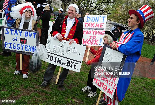 Group dressed in patriotic costumes protest during a "tea party" demonstration in Lafayette Park across from the White House on April 15, 2009 in...