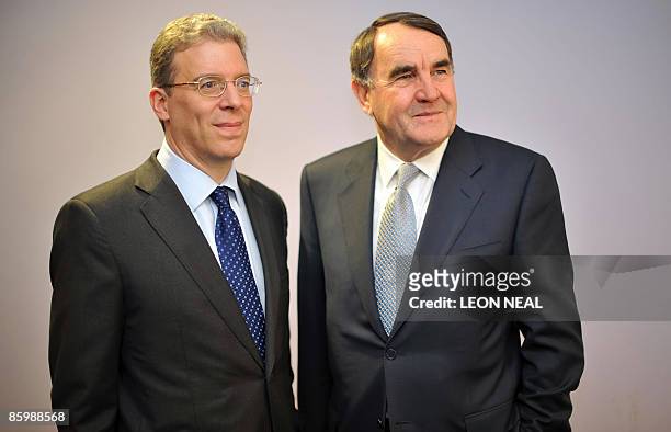 Rio Tinto's Chief Executive Officer Tom Albanese and Chairman Paul Skinner pose for pictures during a press conference following the mining company's...