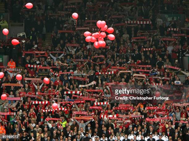 The Liverpool Kop End sing 'You'll Never Walk Alone" as red balloons for each of the 96 Hillsborough victims are released during the Hillsborough...