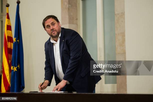 Vice President of Catalonia Oriol Junqueras signs the proposal for declaration of independence during a general assembly at the Parliament of...
