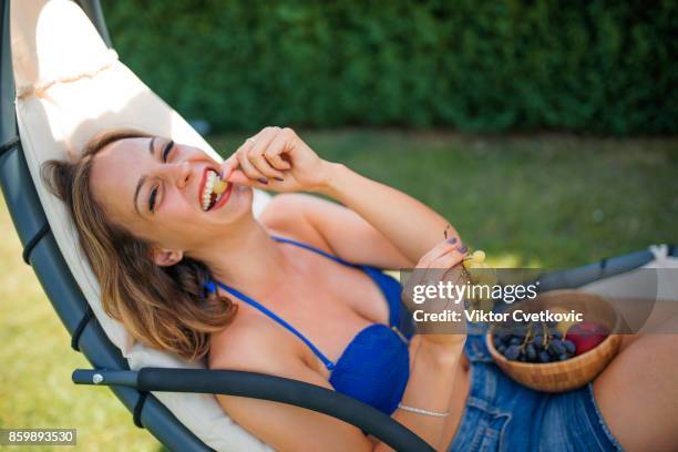 cute girl on vacation - peach tranquility stock pictures, royalty-free photos & images