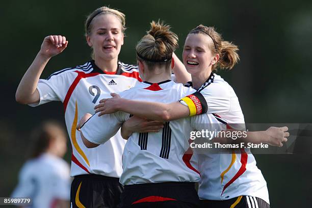 Lena Petermann, Jacqueline de Backer and Annabel Jaeger of Germany celebrate during the women's U15 International friendly match between Germany and...